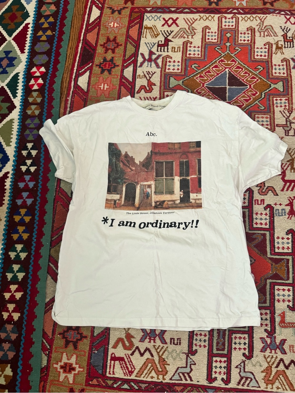 Abc. Men’s White Graphic Tee - "I am ordinary!!"